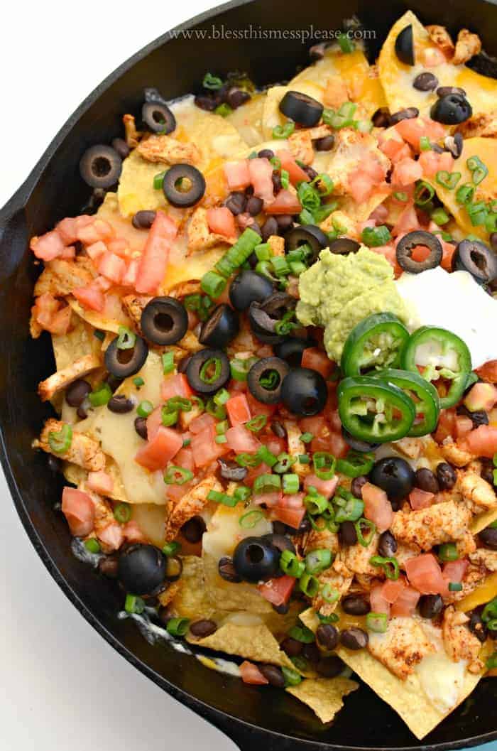 Easy Chicken Skillet Nachos Recipe in a cast iron pan