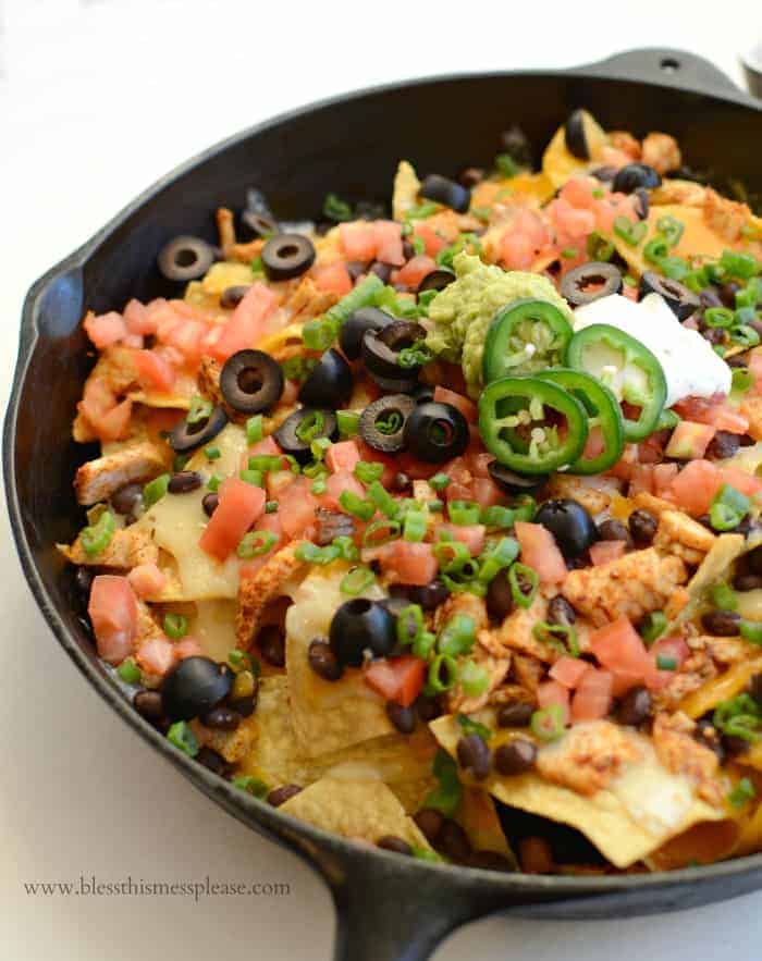 Easy Chicken Skillet Nachos in a cast iron pan