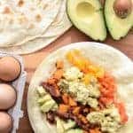 Quick, easy, and healthy Roasted Sweet Potato Breakfast Burritos made with roasted sweet potatoes, eggs, avocado and bacon. This recipe is done in 20 minutes and the perfect breakfast for dinner meal.