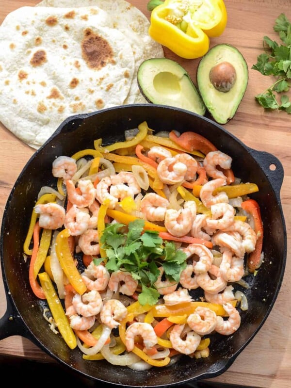 Shrimp fajitas are one of my favorite 20 minute meal ideas that the whole family loves. They come together fast and are full of vegetables!