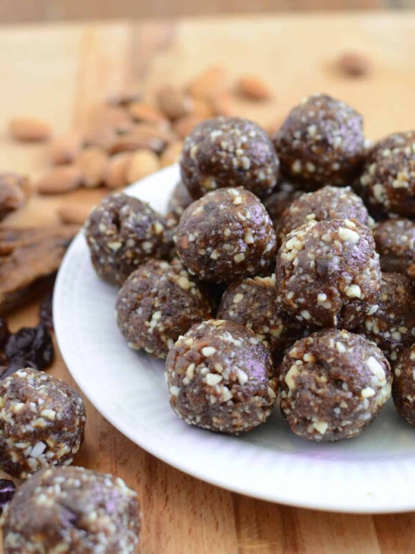 Healthy Cherry Energy Balls are an easy, freezer-friendly whole food dessert that are the perfect afternoon pick me up. Made with dates, almonds, dried cherries, and not much else! These are going to become a staple in your freezer in no time!