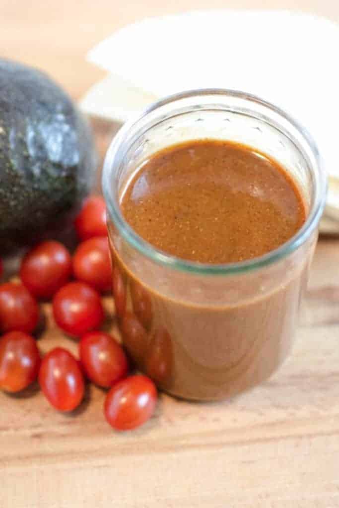 A jar of homemade red enchilada sauce