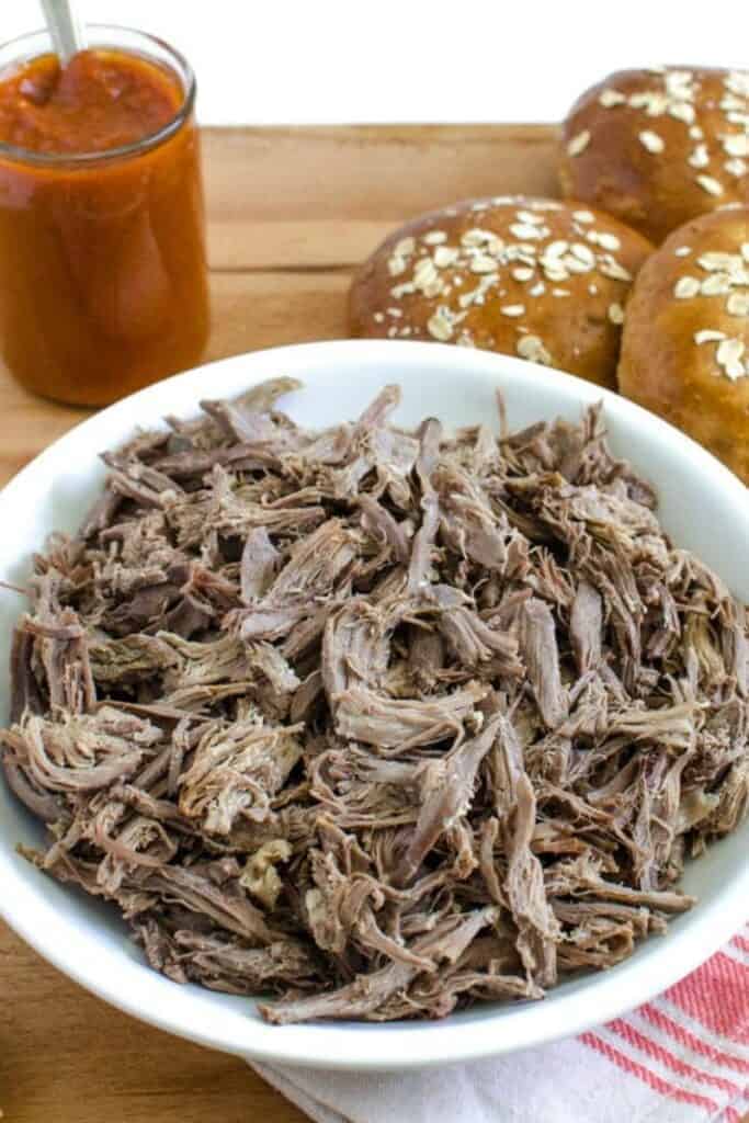 shredded beef in a white bowl no dressing