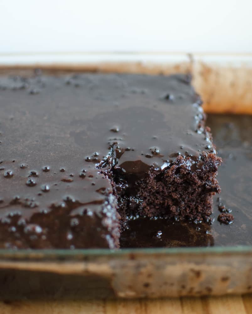 Chocolate Zucchini Cake made from 3 cups of grated zucchini with a rich pourable icing on top. The Best Chocolate Zucchini Cake recipe ever! It turns out perfect every time!