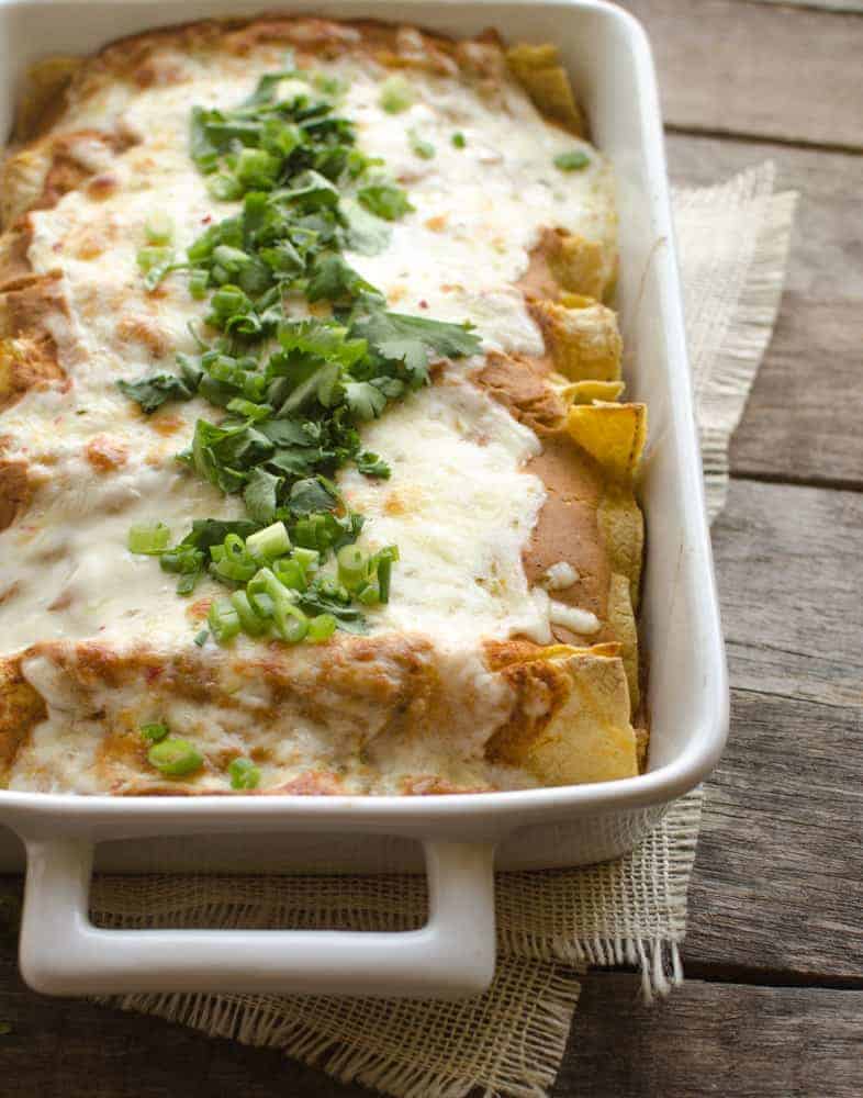 In Creamy Pumpkin Chicken Enchiladas, your favorite Mexican meal meets fall.