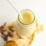 a glass milk jar with pumpkin smoothie recipe from a top view