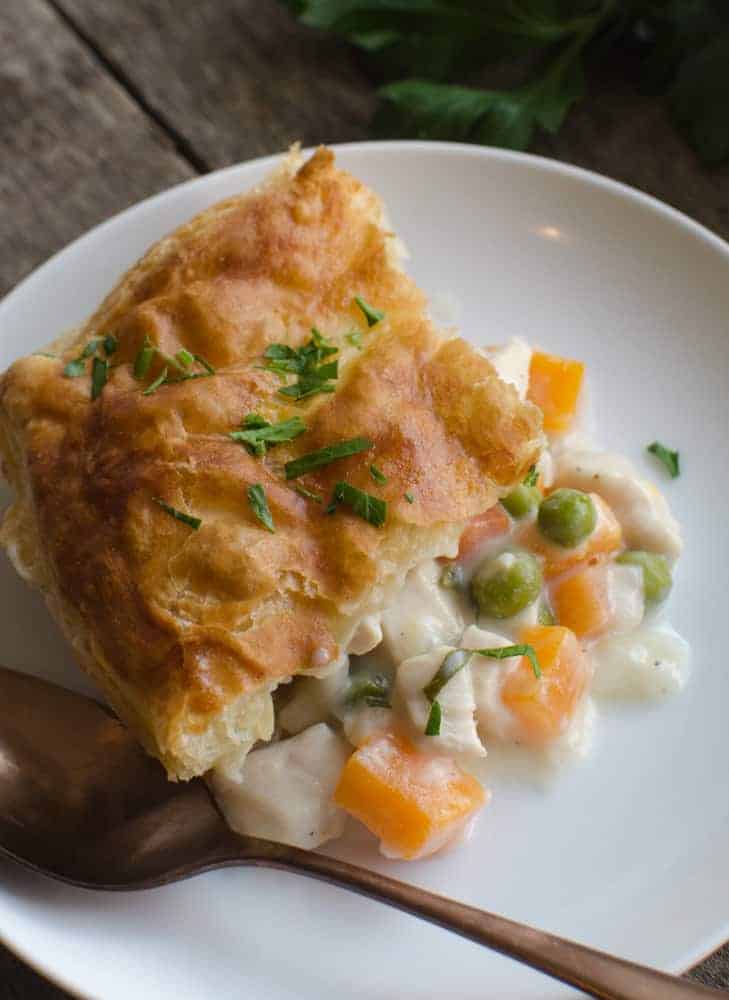 Easy Chicken Pumpkin Pot Pie is a fun fall dish because it uses pumpkin cubes in place of the traditional potatoes and puff pastry in place of the pie crust.