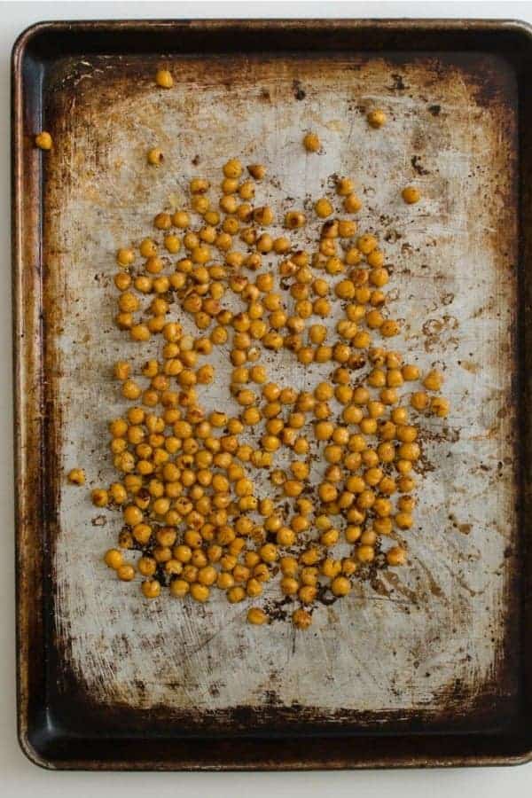 Top view of roasted chickpeas on a baking sheet