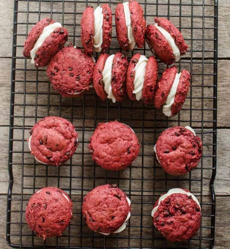 Easy Red Velvet Sandwich Cookies that start with a cake mix are pretty-in-pink crowd-pleasers that are perfect for Valentine’s Day.