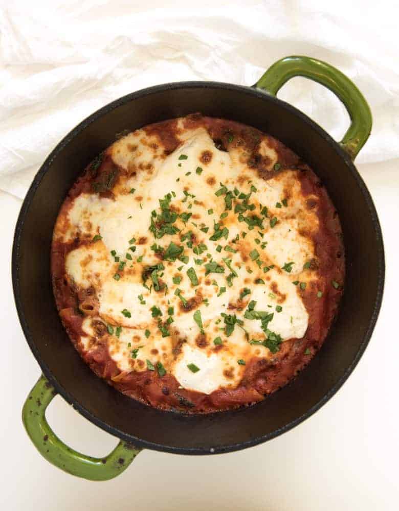 The best cheesy One Pot Baked Ziti recipe with sausage and spinach; everything, including the noodles are cooked in one pot and then finished in the oven.