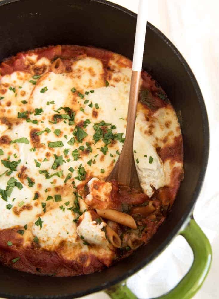 The best cheesy One Pot Baked Ziti recipe with sausage and spinach; everything, including the noodles are cooked in one pot and then finished in the oven.