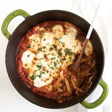 The best cheesy One Pot Baked Ziti recipe with sausage and spinach; everything, including the noodles are cooked in one pot and then finished in the oven.