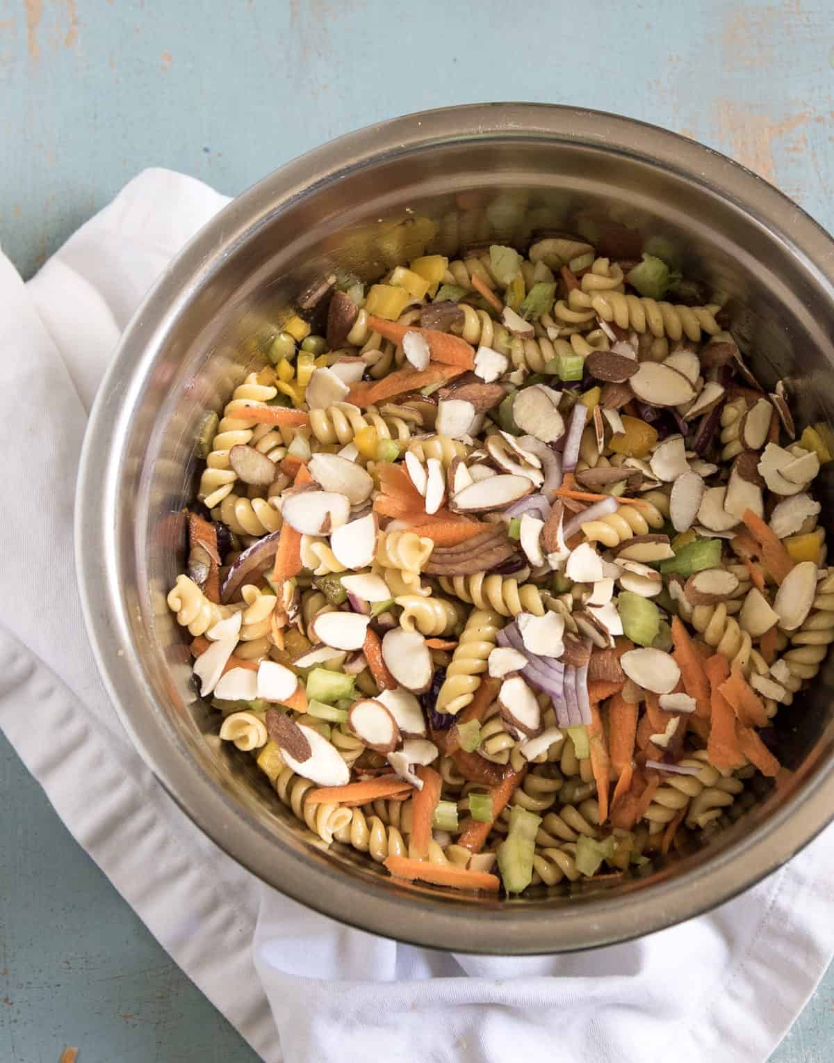 Asian Pasta salad in a metal bowl.