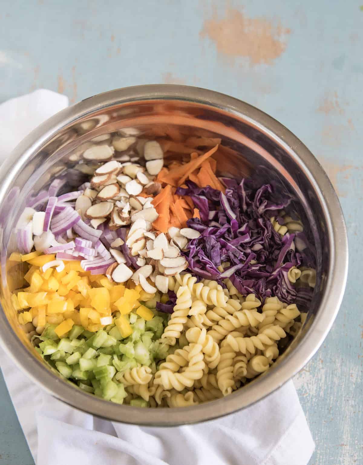 Ingredients of Asian pasta all in a metal bowl. 