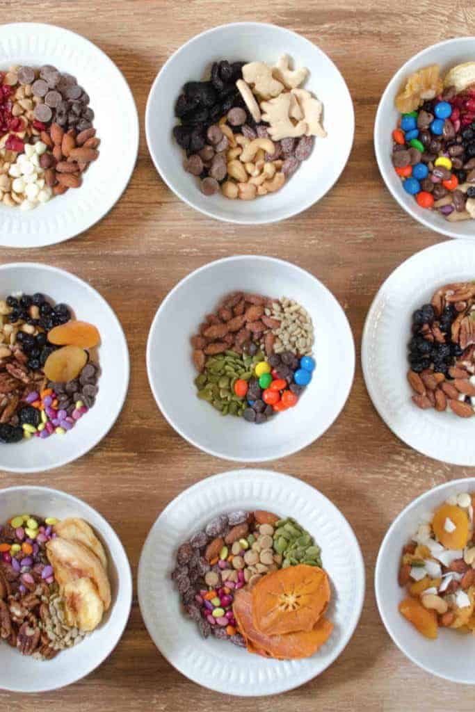 9 bowls of different varieties of homemade trail mix