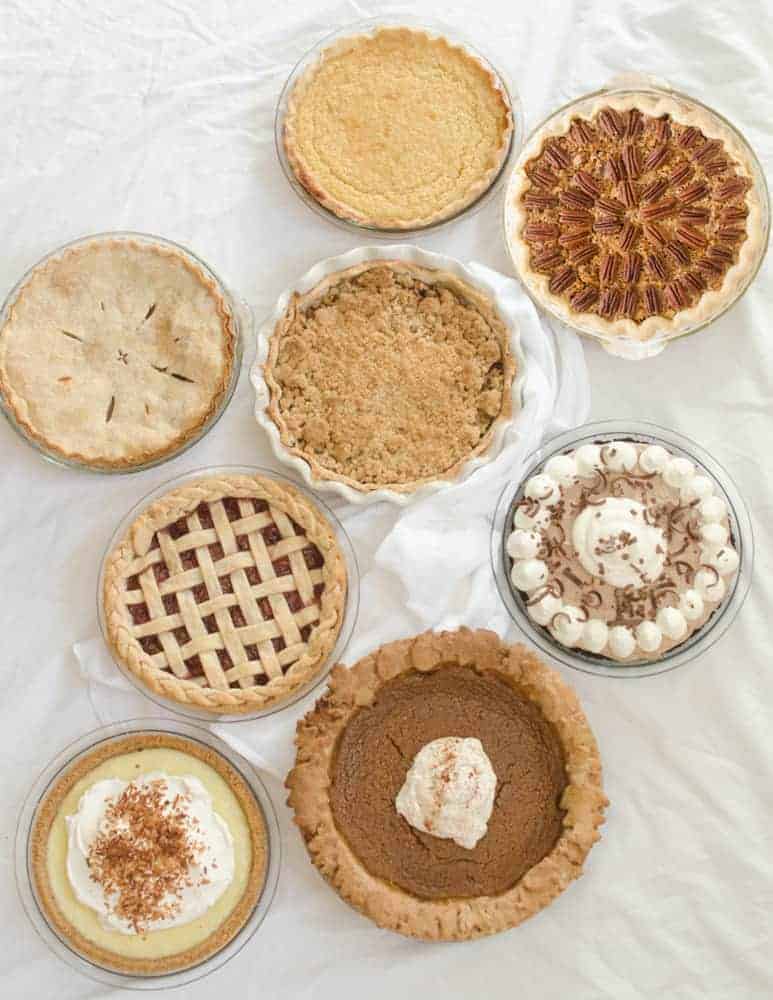 A group of pies on a table.