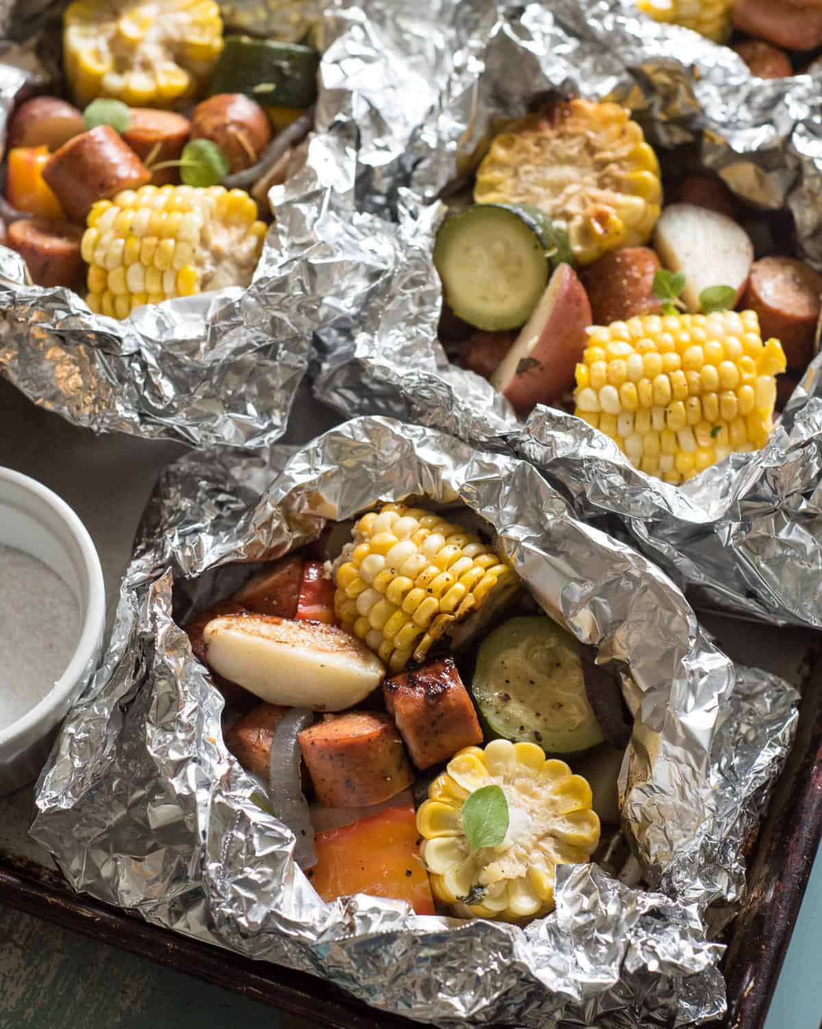 Quick and easy Sausage and Vegetable Foil Packets take about 10 minutes to put together and can be grilled, baked, or cooked over coals.