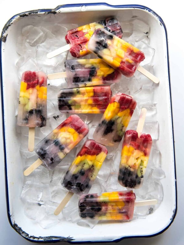 Rainbow popsicles are naturally sweet, loaded with real fruit,  and so simple to make that your kids can almost make them by themselves!