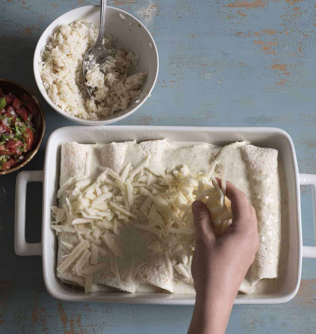 You're only 7 ingredients away from the best easy chicken enchiladas on the block! Simple, family-friendly chicken dinners are always a hit in this house and this one couldn't be more simple to get on the table.