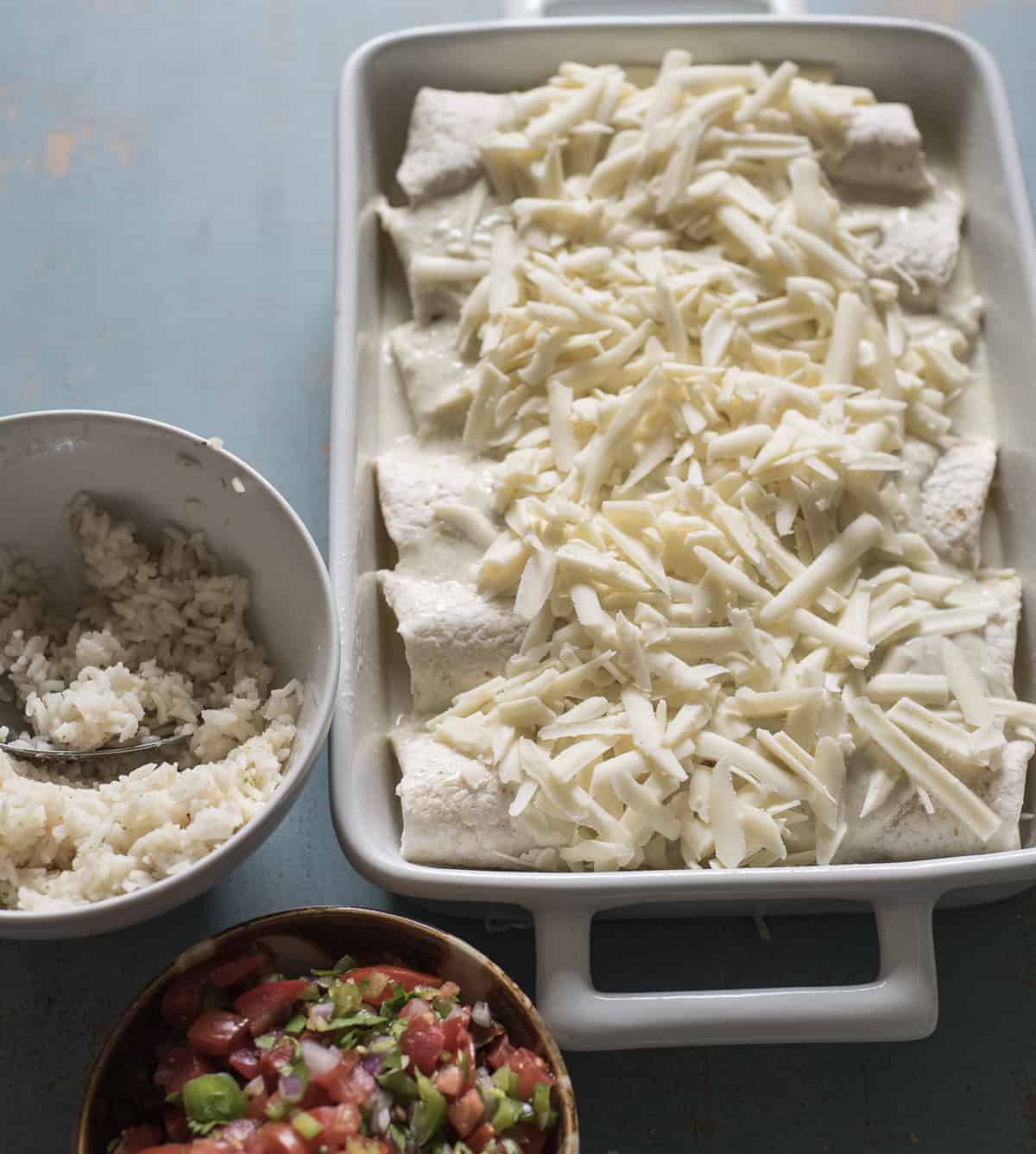 You're only 7 ingredients away from the best easy chicken enchiladas on the block! Simple, family-friendly chicken dinners are always a hit in this house and this one couldn't be more simple to get on the table.