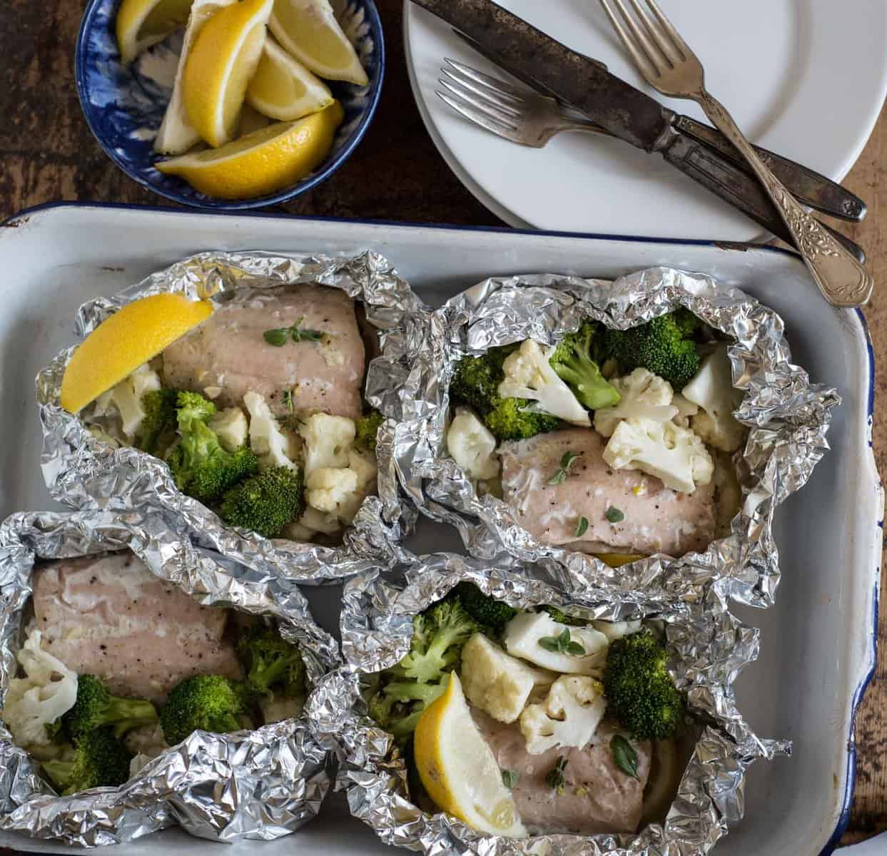 Quick and easy garlic butter baked salmon in foil with broccoli and cauliflower makes an easy dinner recipe that is done in about 20 minutes. 