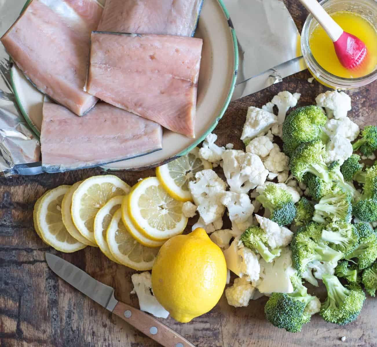 Quick and easy garlic butter baked salmon in foil with broccoli and cauliflower makes an easy dinner recipe that is done in about 20 minutes. 