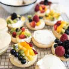 Fruit pizza sugar cookies with various fruit on top.