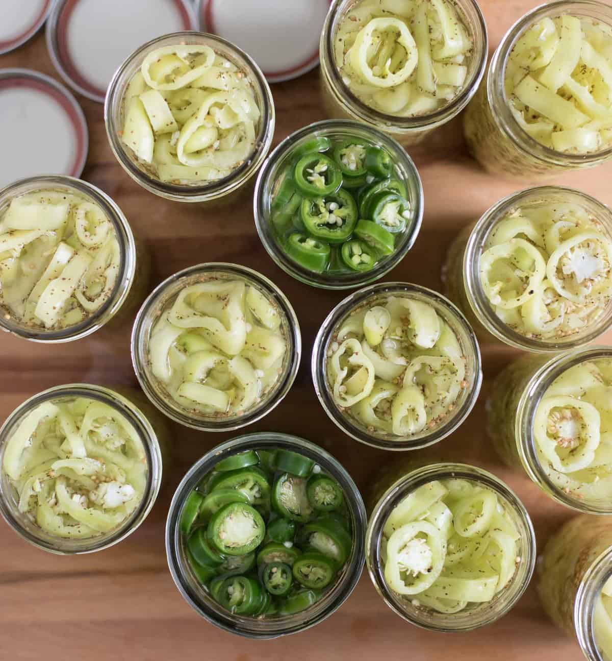 A quick and easy guide on how to pickle peppers using a hot water bath canning method which produces shelf-stable pickled peppers you can eat all winter long.