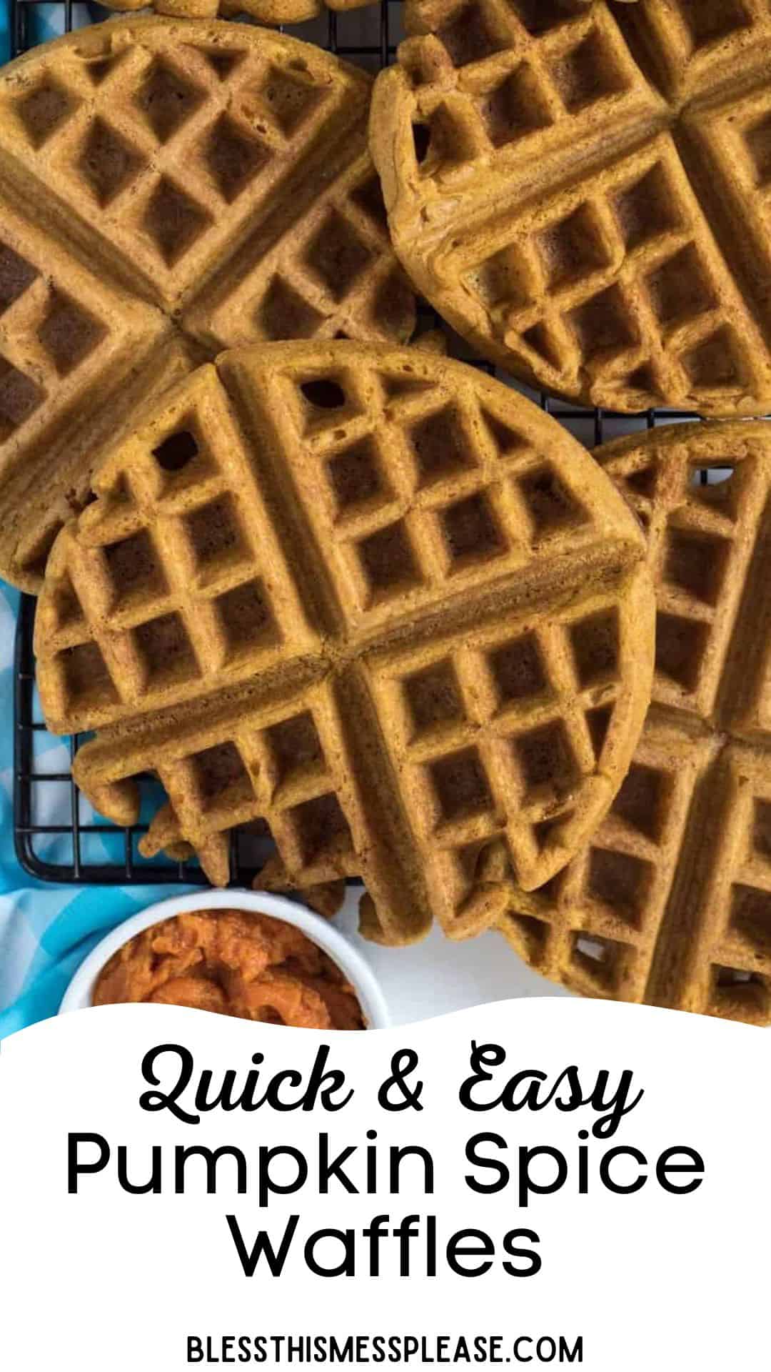Overhead view of several round pumpkin spice waffles on a cooling rack, with a small bowl of pumpkin puree nearby. Text reads “Quick & Easy Pumpkin Spice Waffles” and “blessthismessplease.com” at the bottom. Perfect fall breakfast!.