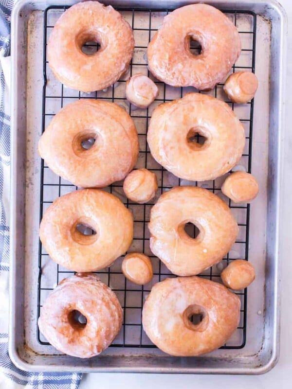 Rack of glazed donuts and doughnut holes