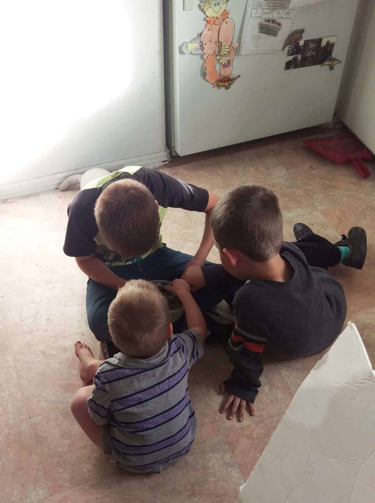 kids playing on the kitchen floor