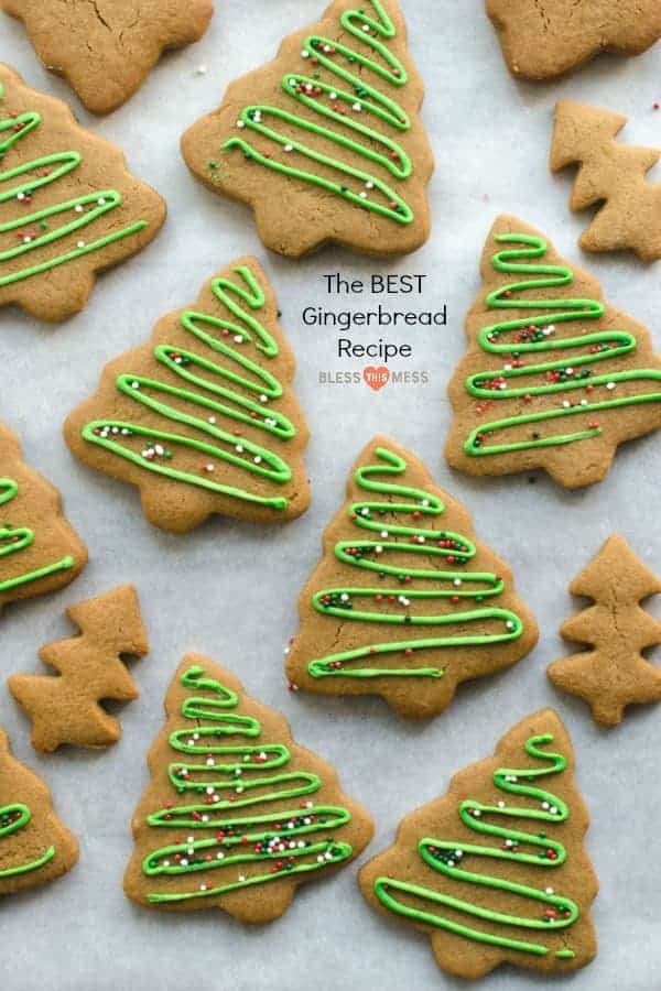 christmas tree shaped cookies with green icing and sprinkles on white