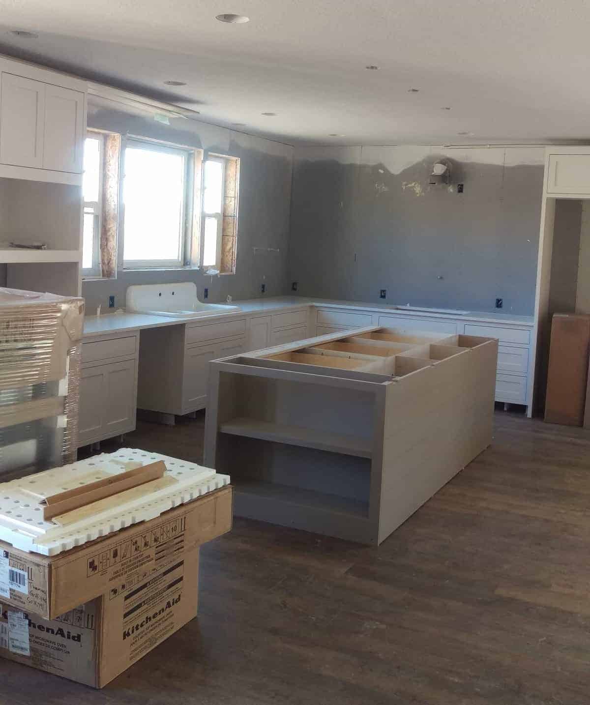 white cabinets and gray walls in the new kitchen