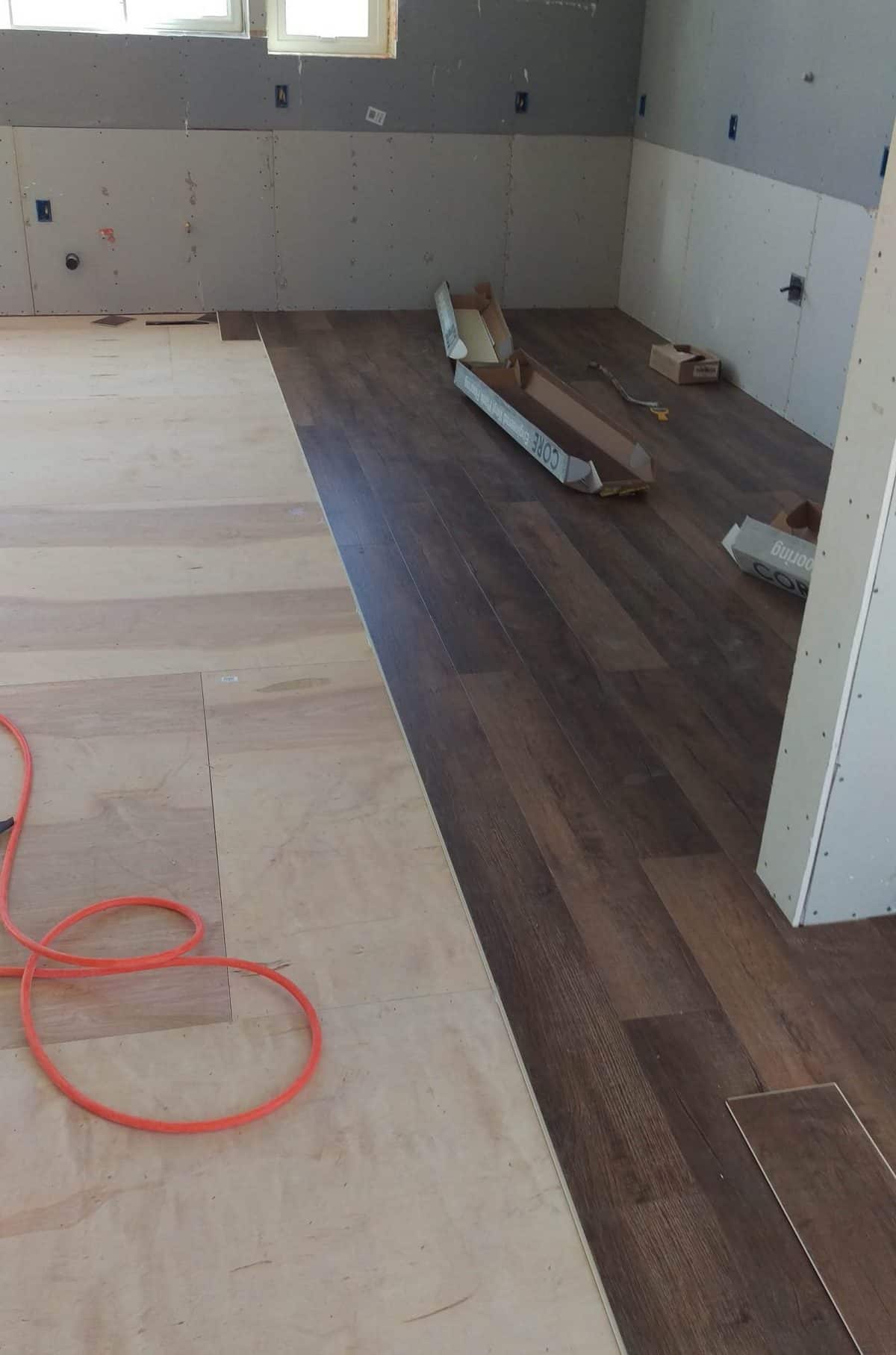 a look at the dark wood floors being installed