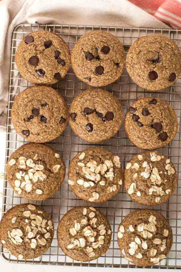 Top view of banana muffins on a cooling rack with chocolate chip or oat topping