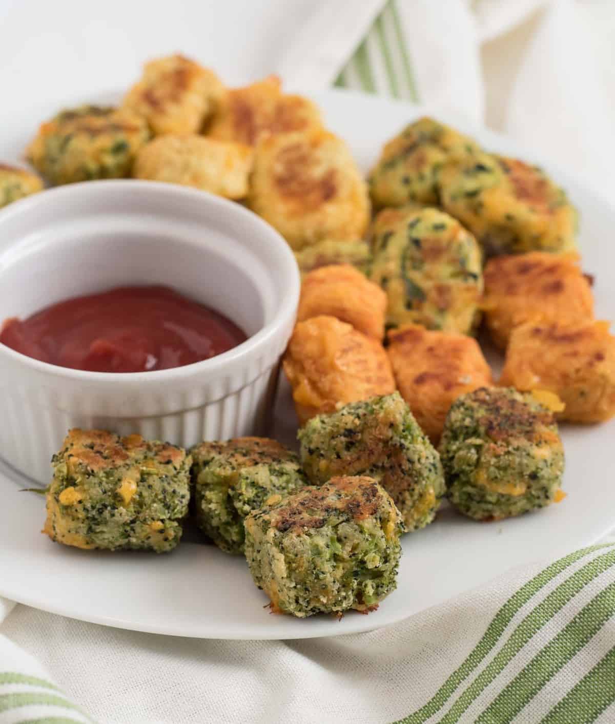 Recipes for healthy veggie tots including broccoli tots, cauli-tots, sweet potatoes tots, zucchini tots, and mixed veggie tots! Perfect for making veggies fun for kids and adults both!