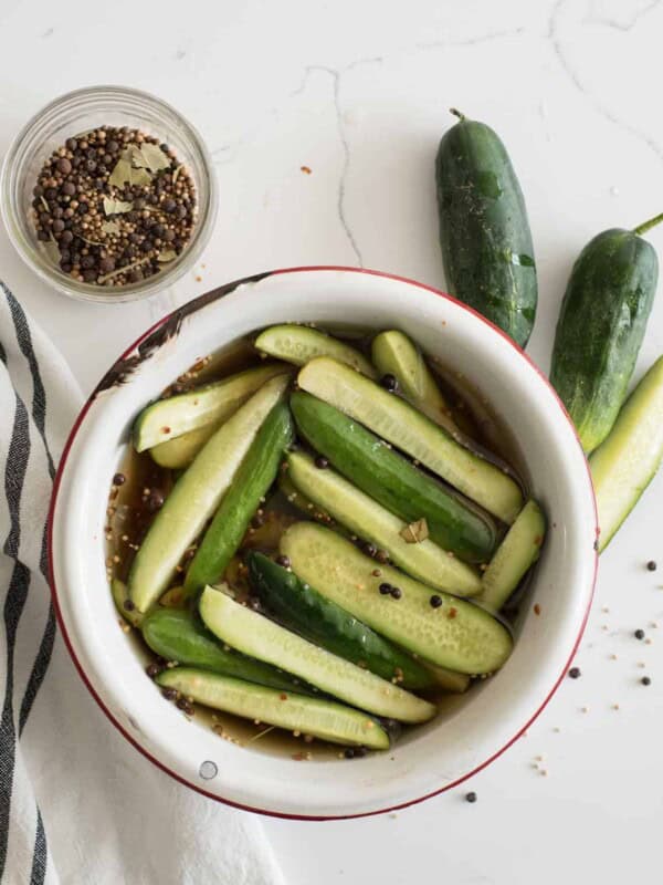 Bowl of sweet and spicy cucumbers and vinegar