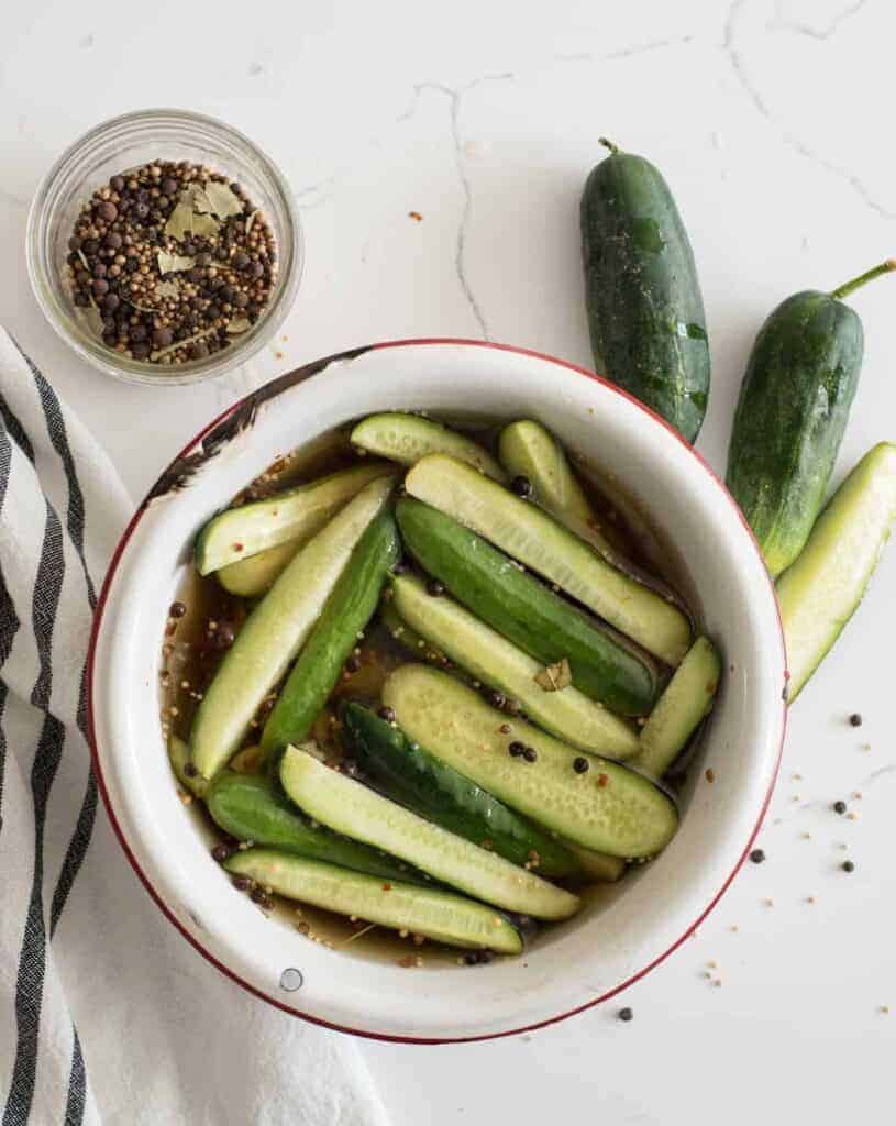Bowl of sweet and spicy cucumbers and vinegar