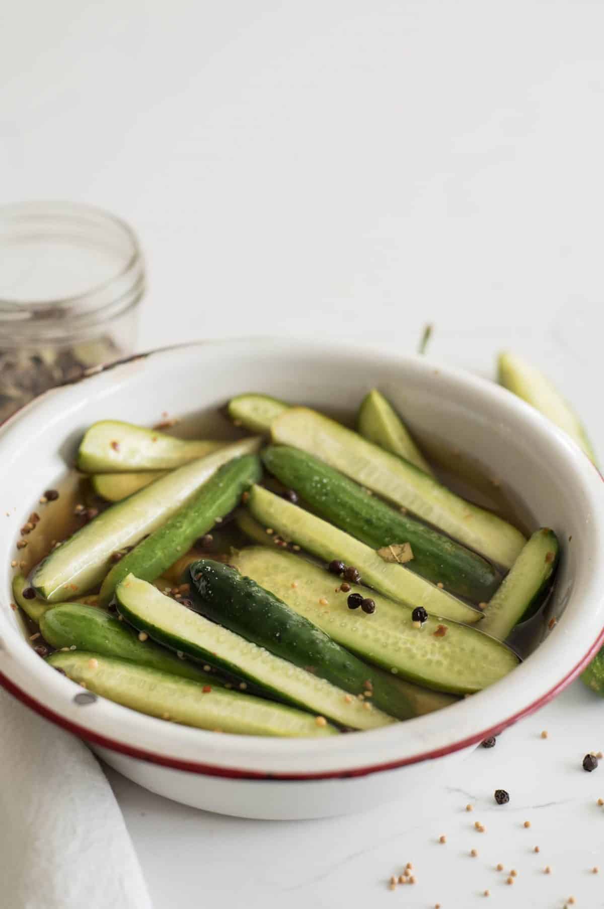 Sweet and spicy cucumbers and vinegar make the most delicious refrigeration pickles that only take about 5 minutes to make.