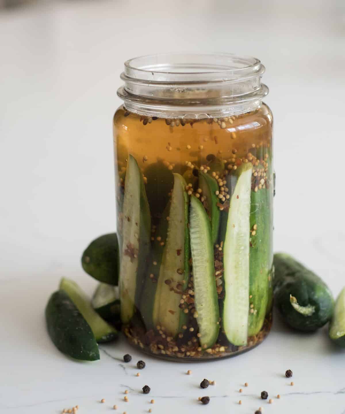 Sweet and spicy cucumbers and vinegar make the most delicious refrigeration pickles that only take about 5 minutes to make.