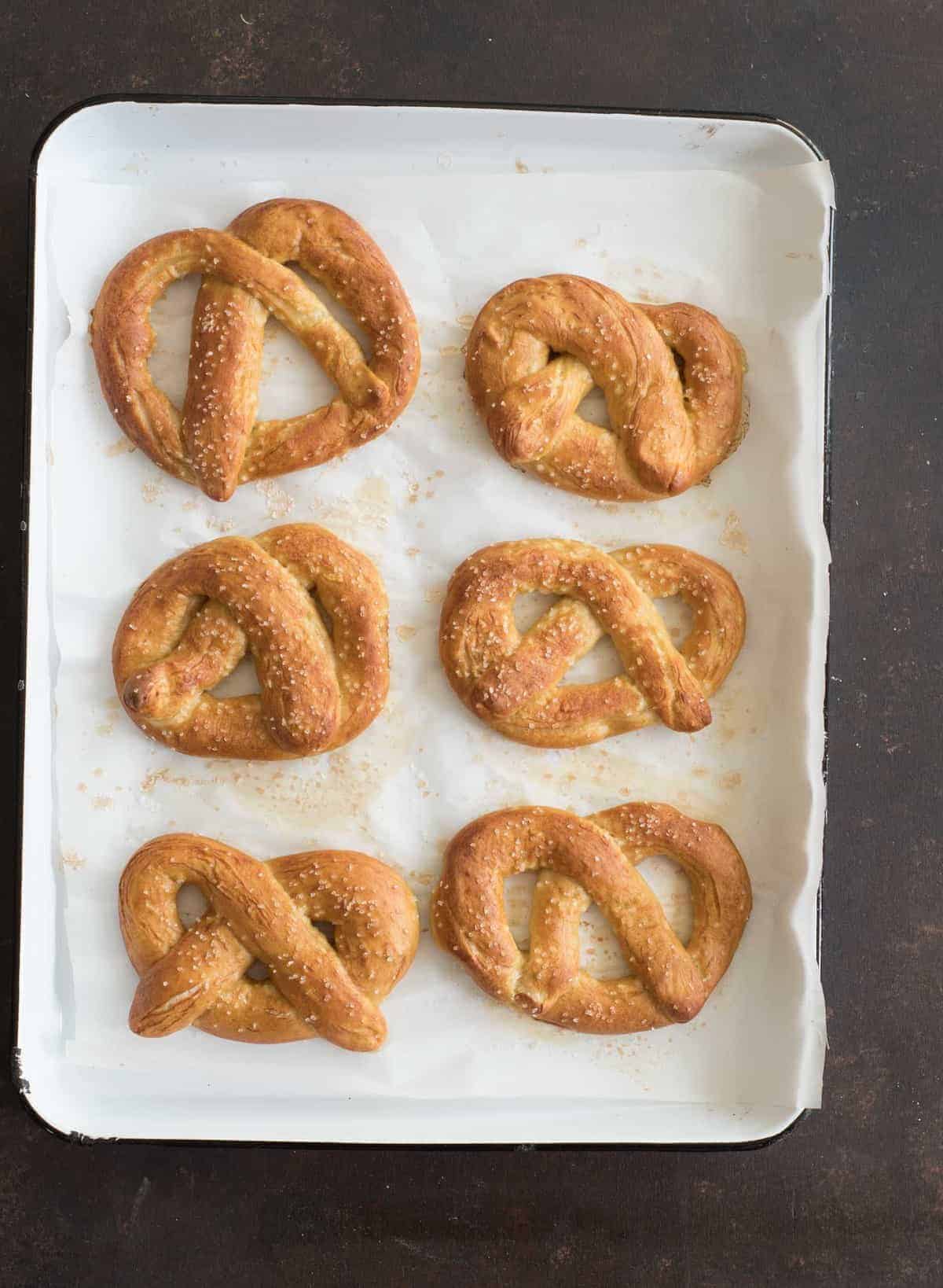 Big soft pretzels made from a simple dough, boiled, and then baked to golden perfection are one of our all time favorite salty and chewy treats.