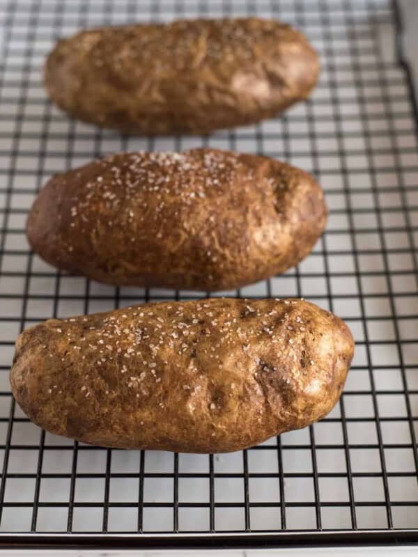 Tray of baked potatoes with salt