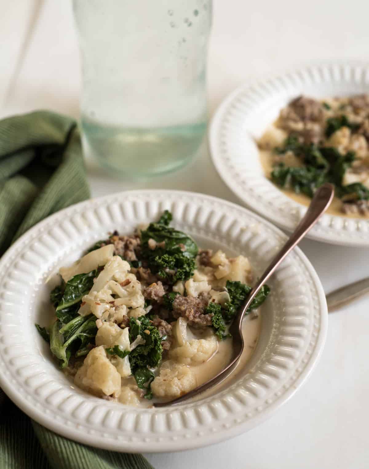 Healthy Cauliflower Sausage and Kale soup is the low carb version of Zuppa Toscana that uses cauliflower in place of the potatoes!