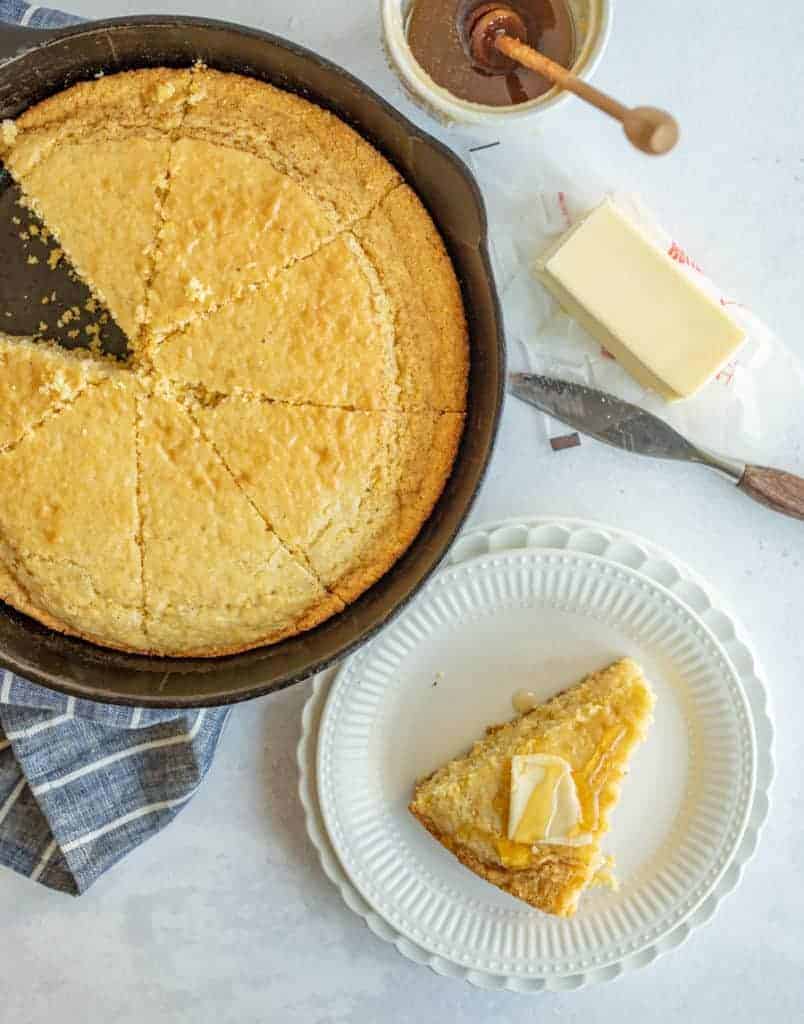 Cornbread in Pan and Slice of cornbread on white plate