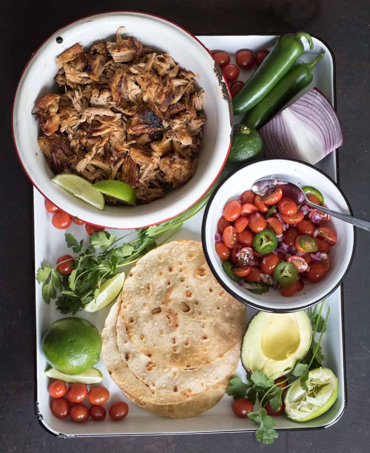 The best Instant Pot pork taco recipe on the internet. The secret is a whole lot of seasoning cooked into the pork and then finishing the dish under the broiler in your oven.