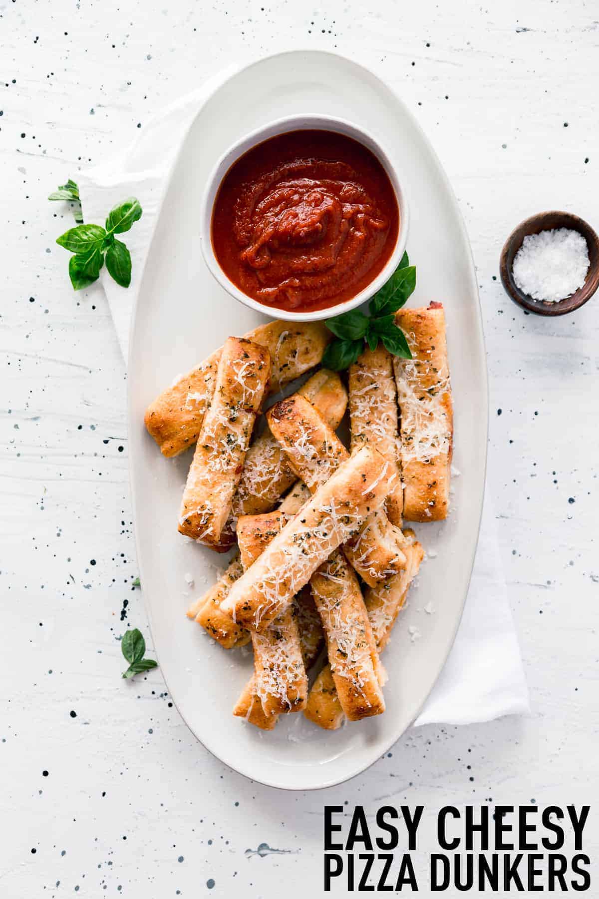 Easy cheesy pizza sticks are made with store-bought dough, pizza sauce, and cheese and only take 20 minutes to make, start to finish. 