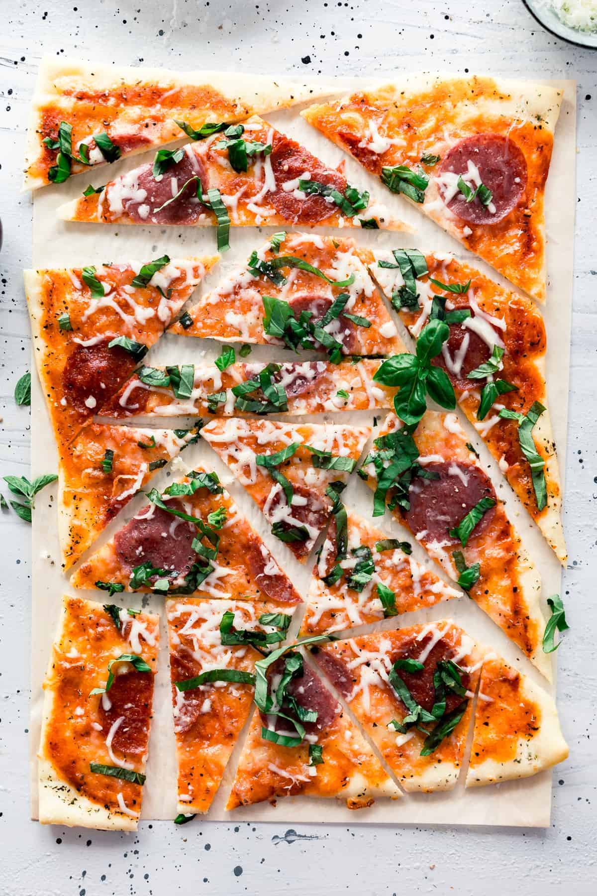 Meaty Margherita Pizza made with the traditional tomatoes, cheese, and basil but with added pepperoni and salami to make it one crowd pleasing pizza done in only 30 minutes.