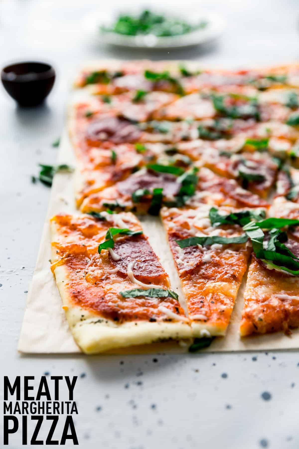Meaty Margherita Pizza made with the traditional tomatoes, cheese, and basil but with added pepperoni and salami to make it one crowd pleasing pizza done in only 30 minutes.