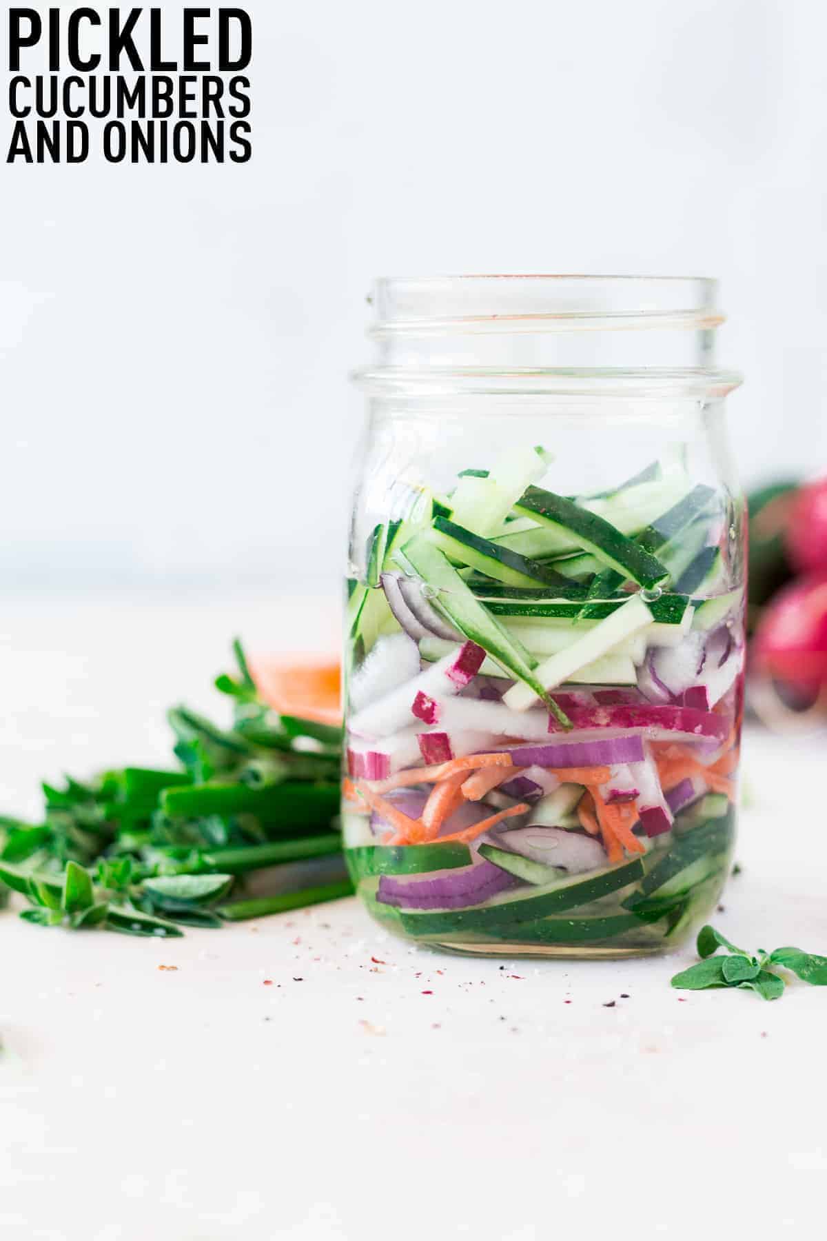 Quick pickled cucumbers and onions made with optional carrots and radishes make the perfect addition to salads, sandwiches, and more!