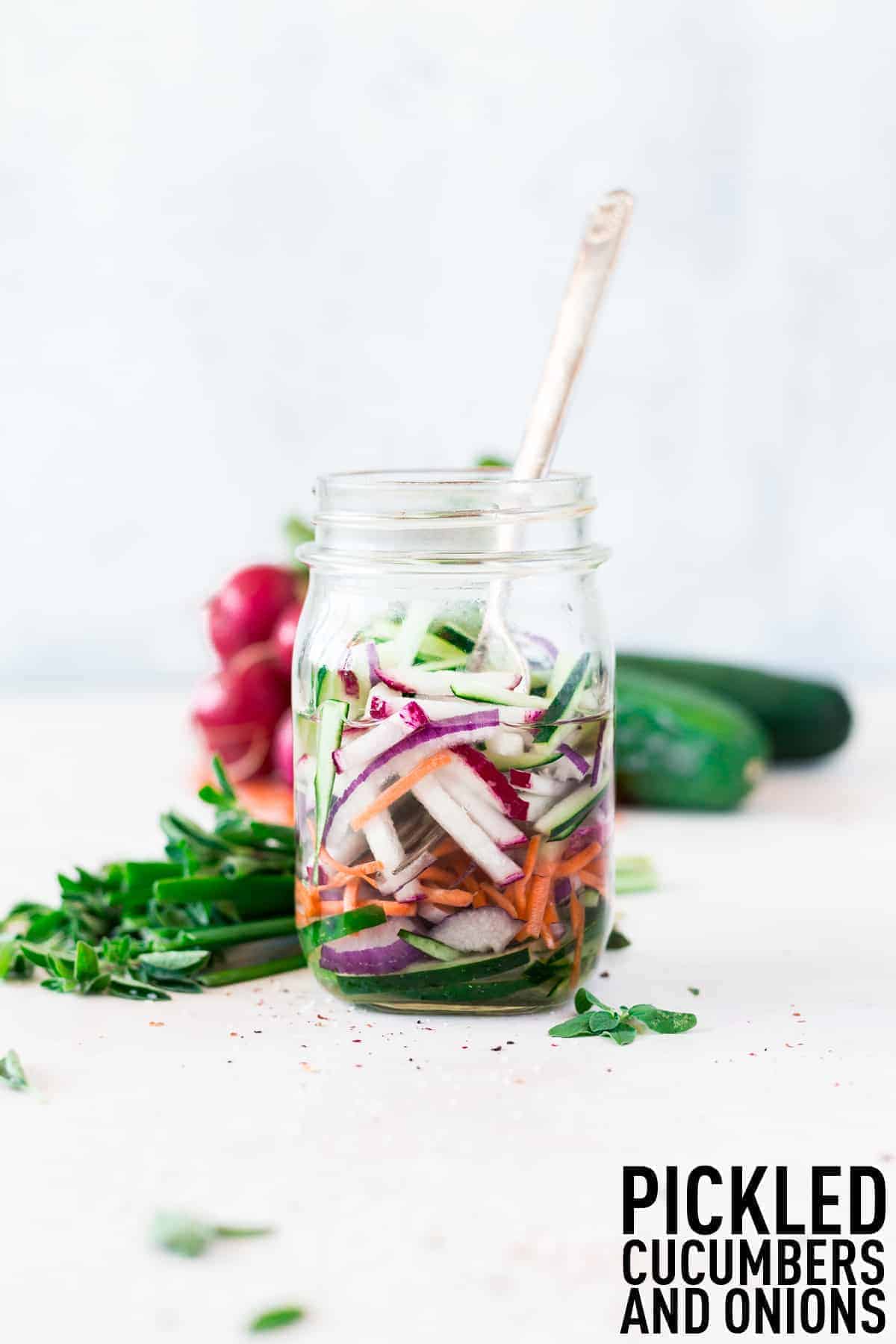 Quick pickled cucumbers and onions made with optional carrots and radishes make the perfect addition to salads, sandwiches, and more!